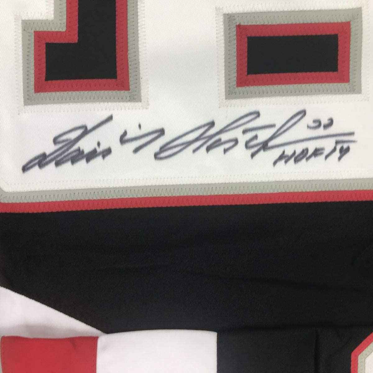 Autographed/Signed Dominik Hasek HOF 14 Buffalo Black Hockey Jersey JSA COA