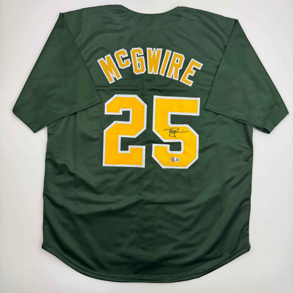 Autographed/Signed Mark McGwire Oakland Green Baseball Jersey Beckett BAS COA