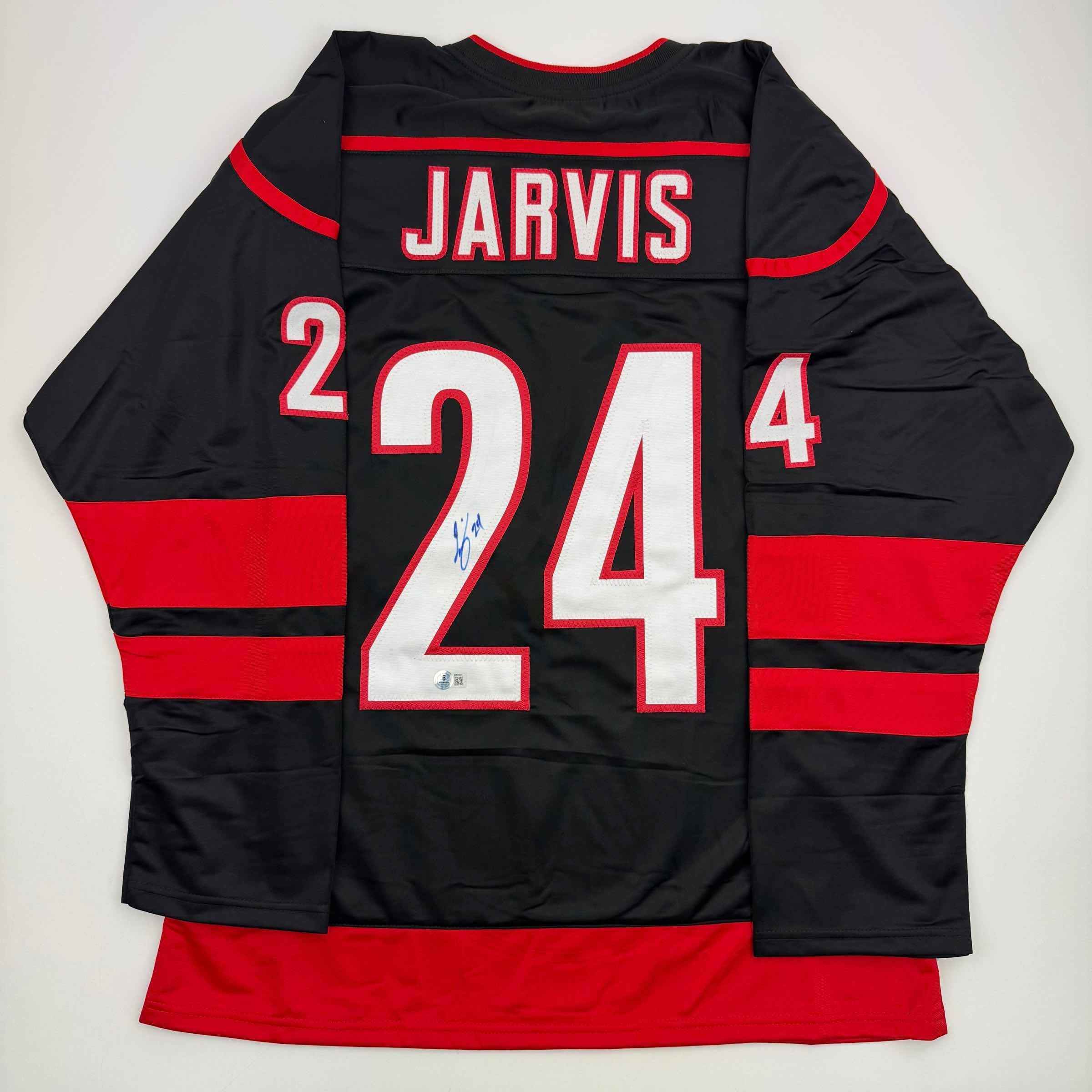 Autographed/Signed Seth Jarvis Carolina Black Hockey Jersey Beckett BAS COA