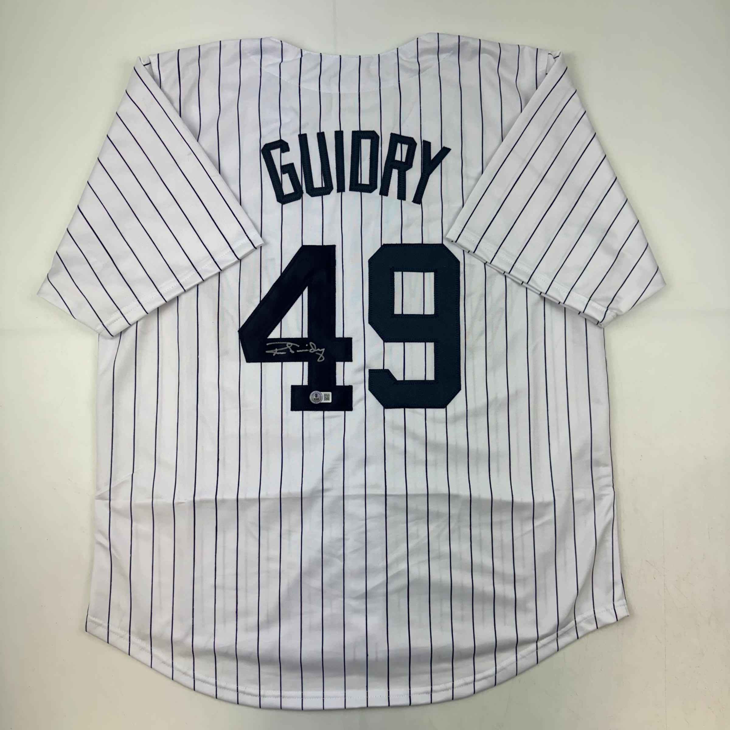Autographed/Signed Ron Guidry New York Pinstripe Baseball Jersey Beckett BAS COA